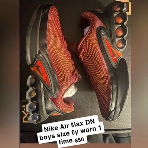 Nike Kids' Sneakers in Black with Orange Accents